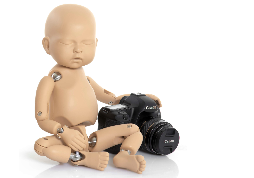 A photo of a StandInBaby with a camera