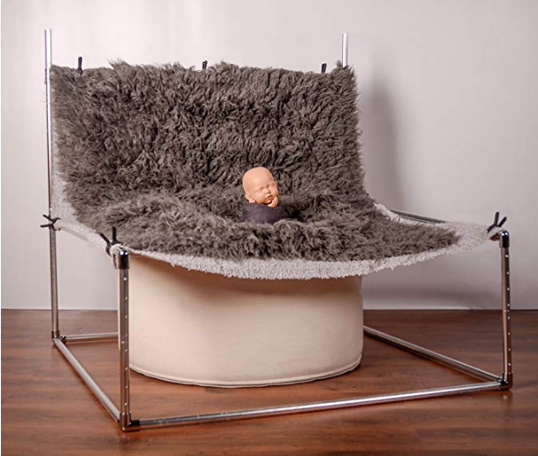 Image showing the set up of a newborn photo backdrop frame with blanket clamped to frame suspended over the beanbag